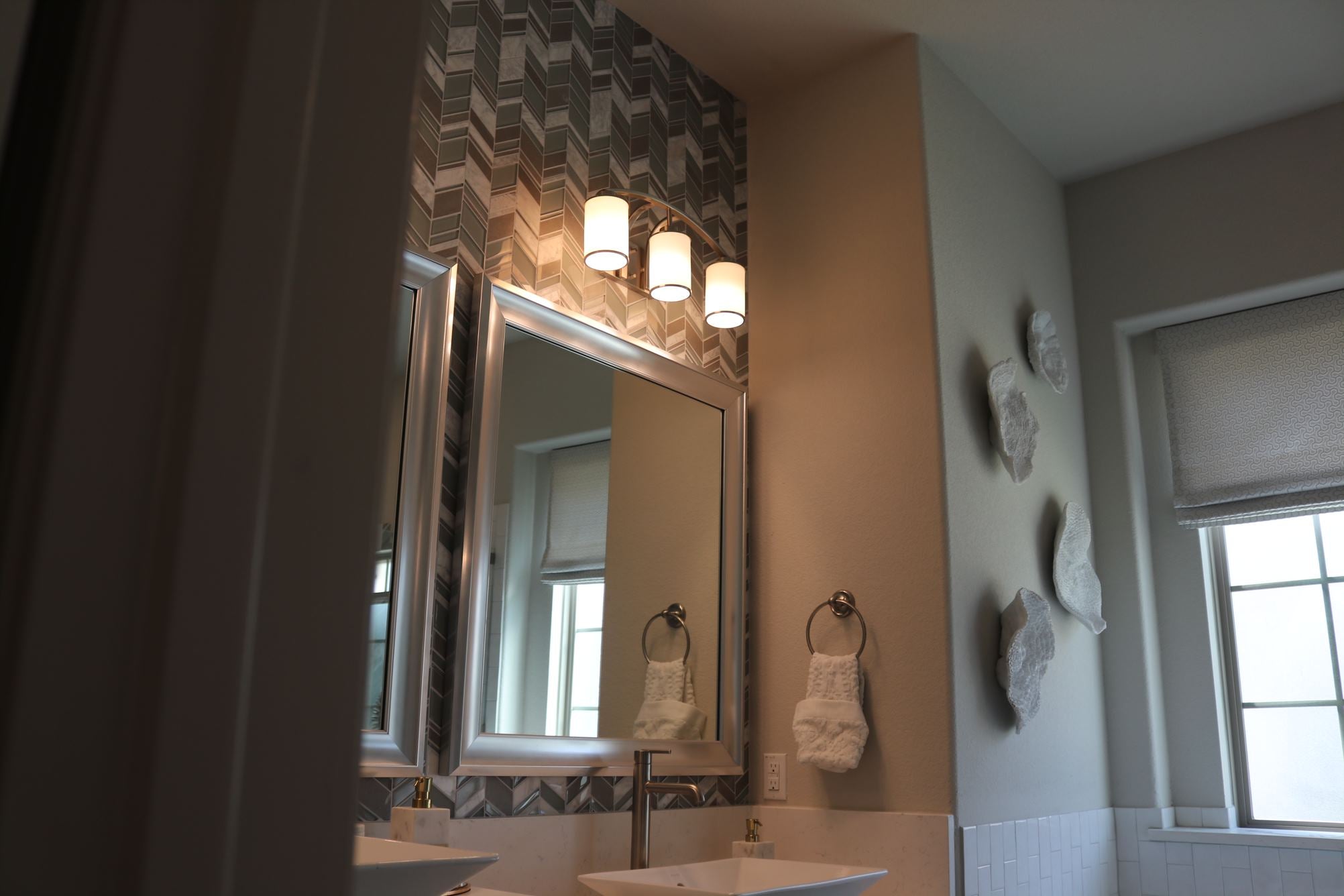 3 light brushed nickel vanity light over mirror