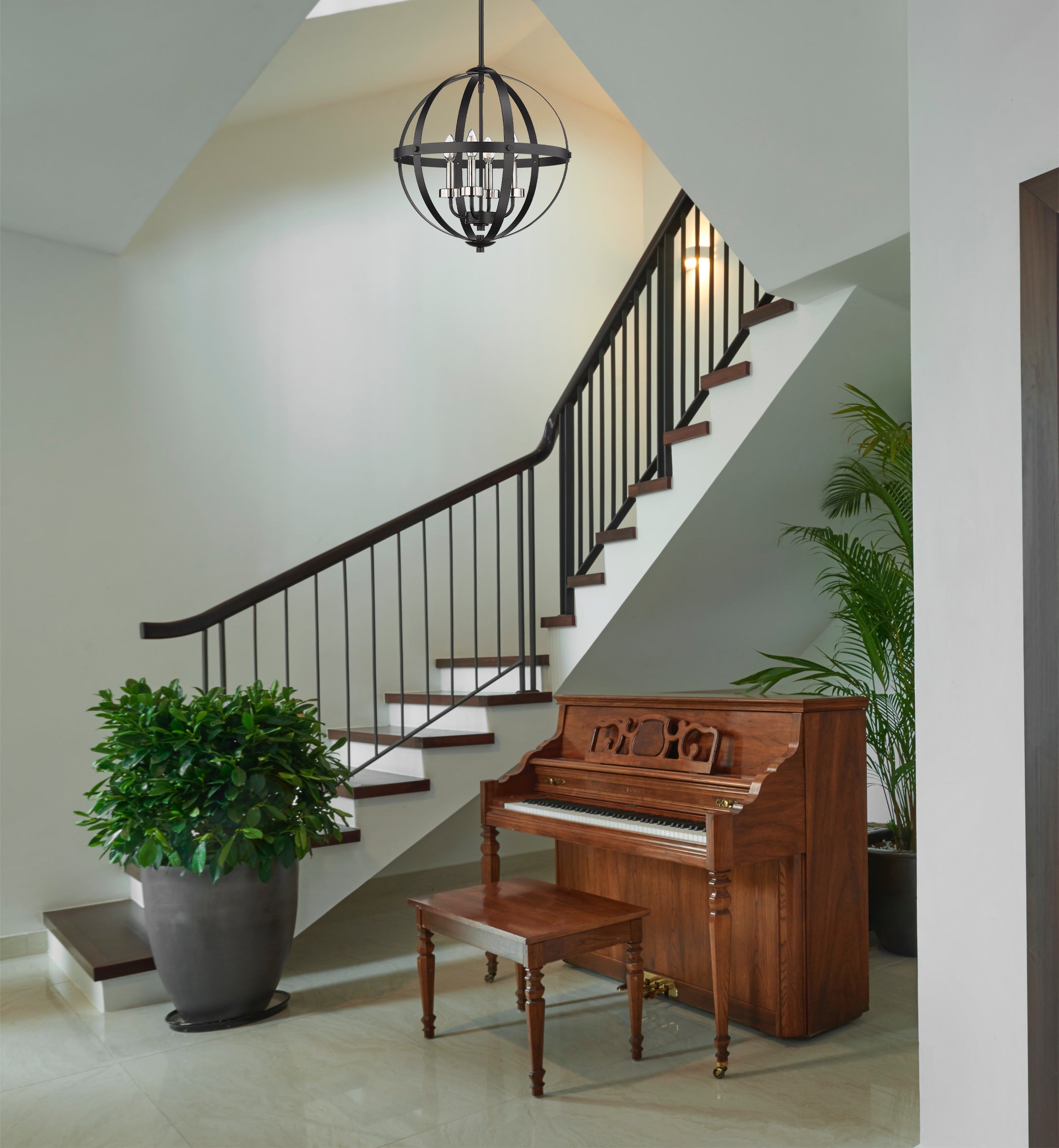 Modern black globe chandelier staircase